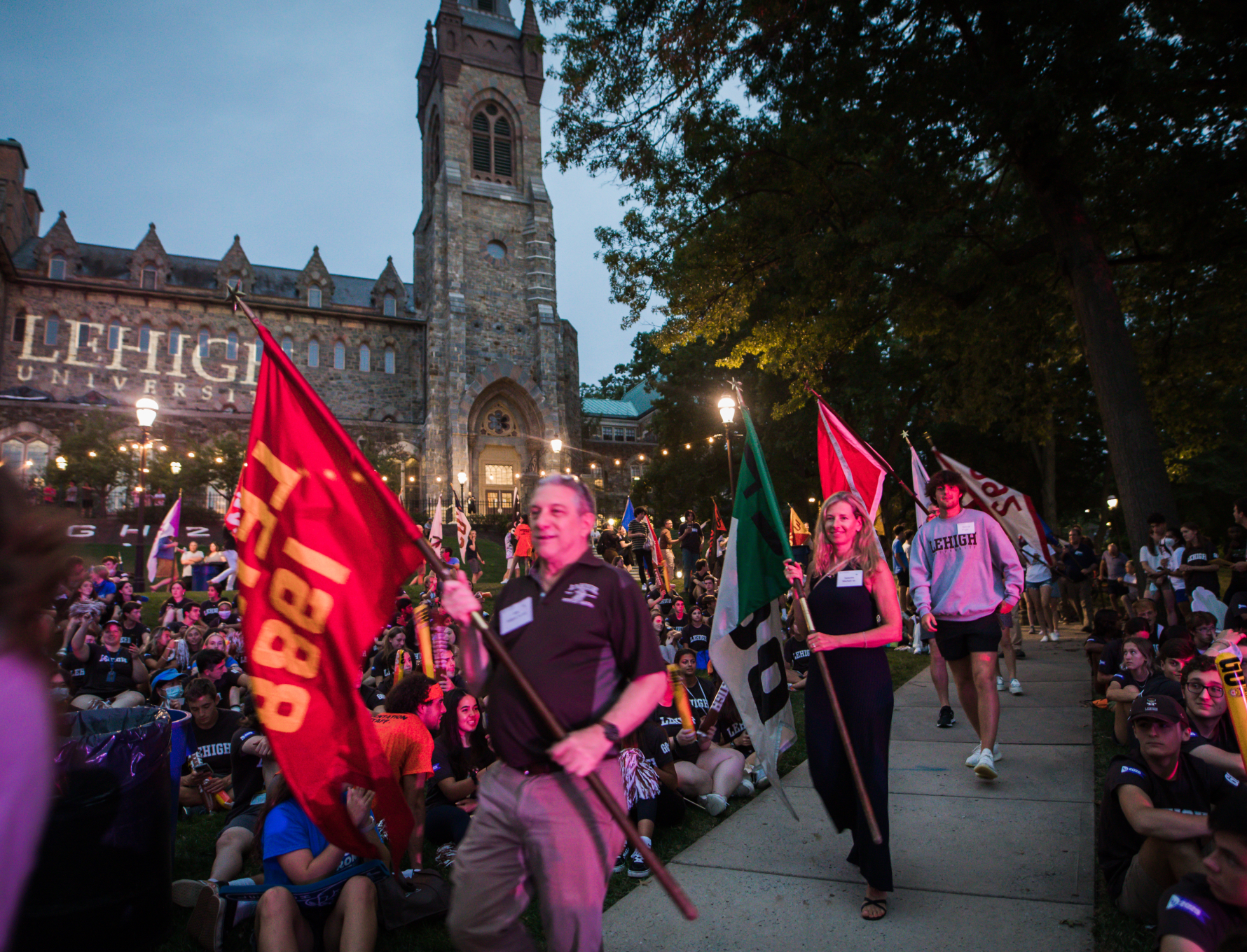 Alumni representing the classes of 1953 through 2023 carry their class flags