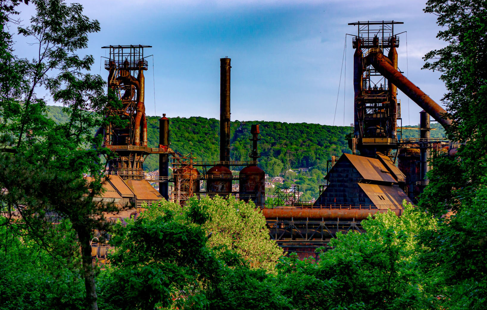 Steel Stacks surrounded by green foliage