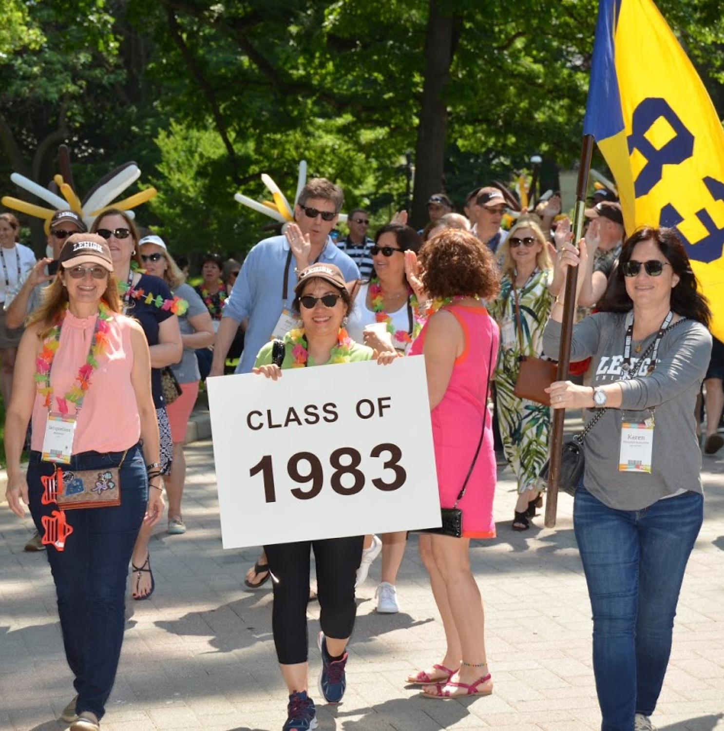 Woman holding class of 1983 sign