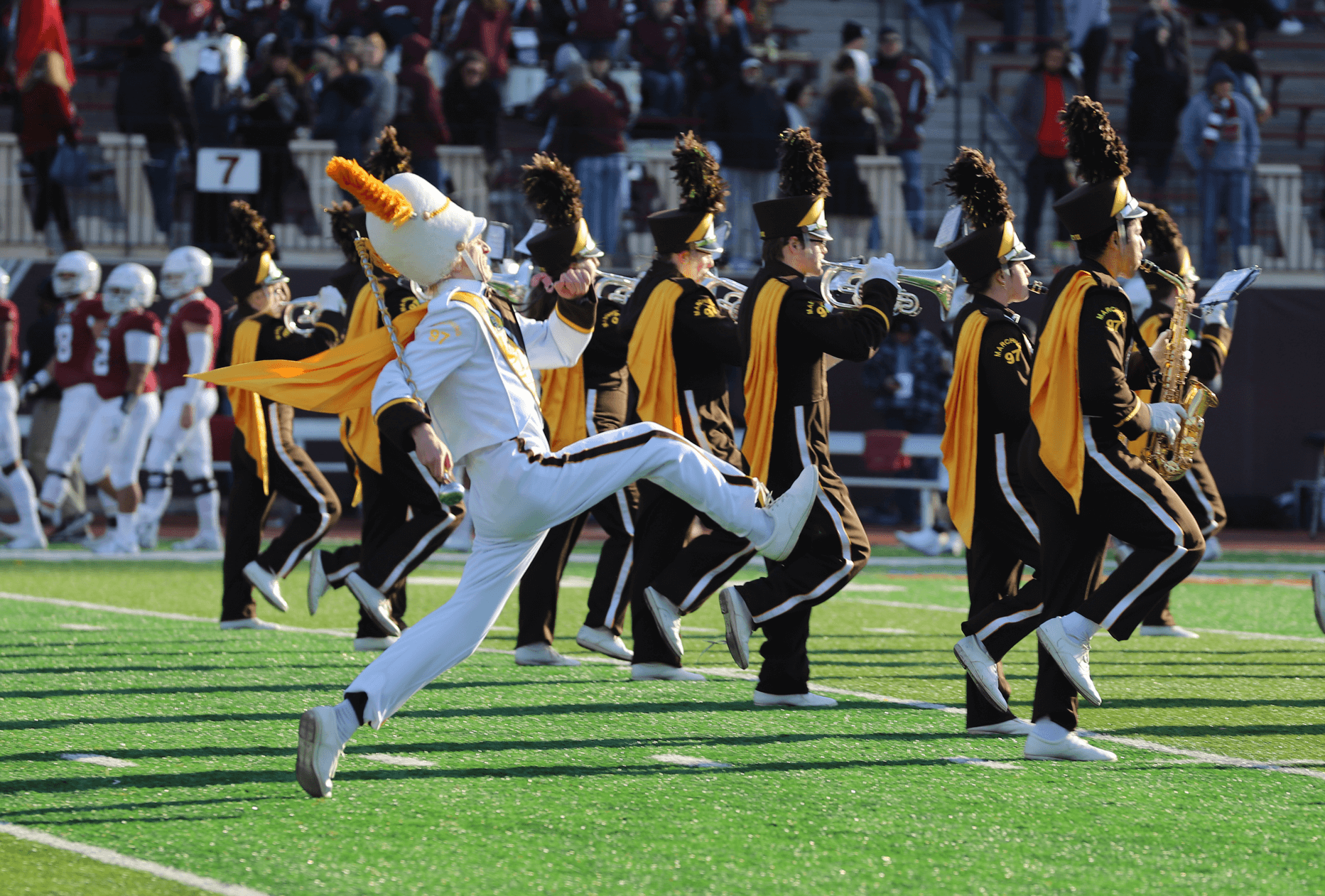 Brown and white marching band performing on Lafayette stadium