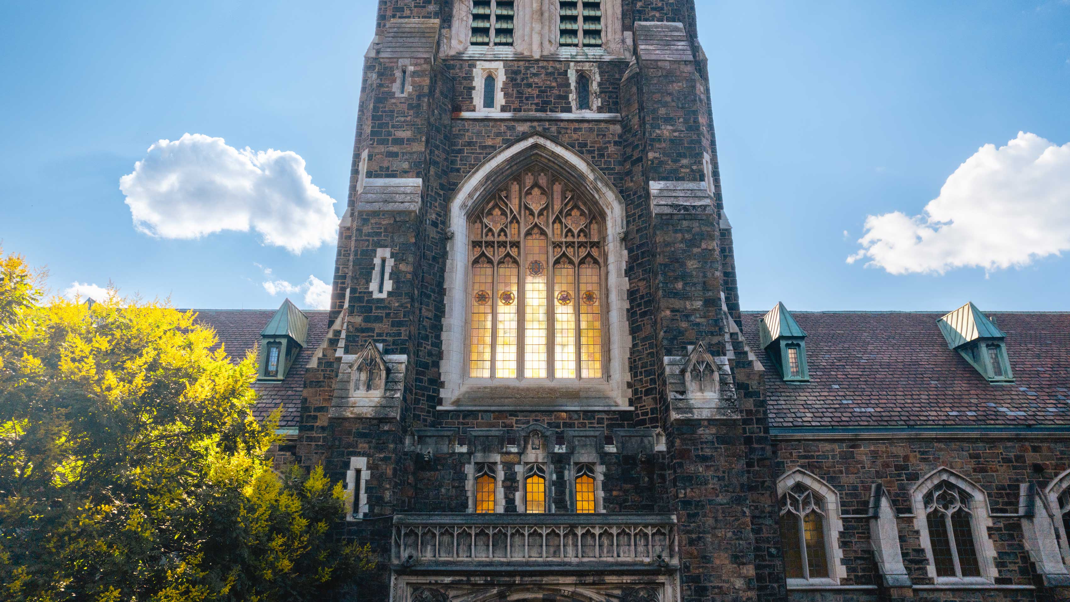 Large arched window on the street side of the Alumni Memorial building.