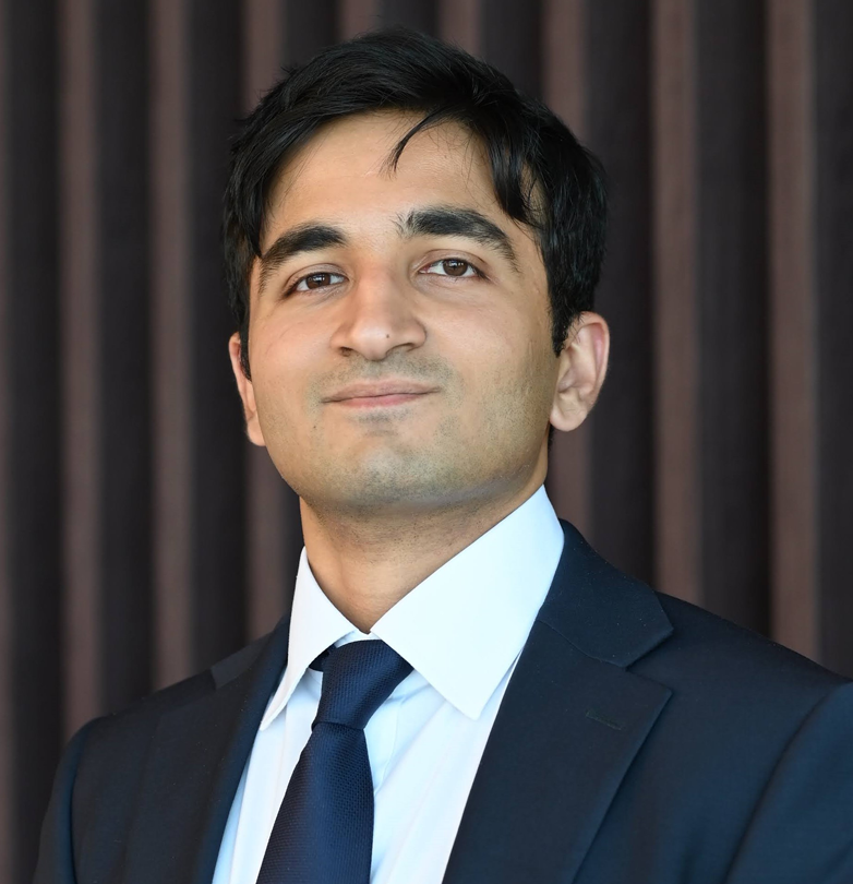 Muzammil Jawed professional headshot, wearing a navy suit and tie