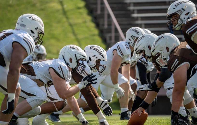 The Lehigh football team in formation and ready to snap the ball.