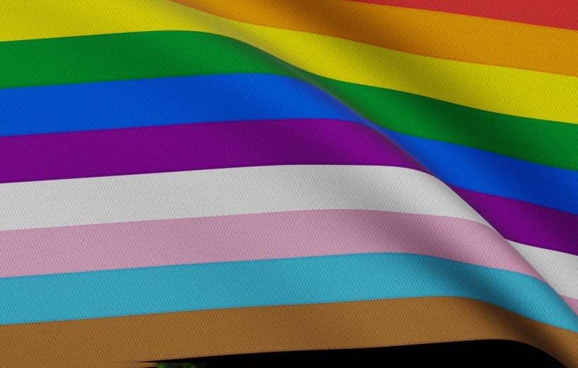 Close up of a flag with rainbow stripes