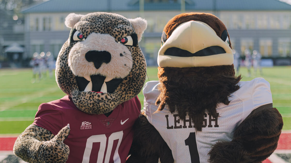 Clutch and the Leopard posed together on the football field