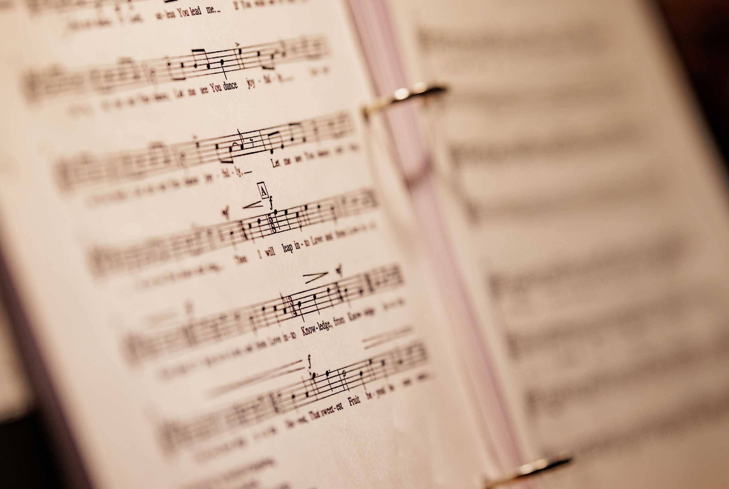 Sheet music resting in an open binder.