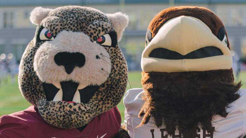 Clutch and the Leopard posed together on the football field