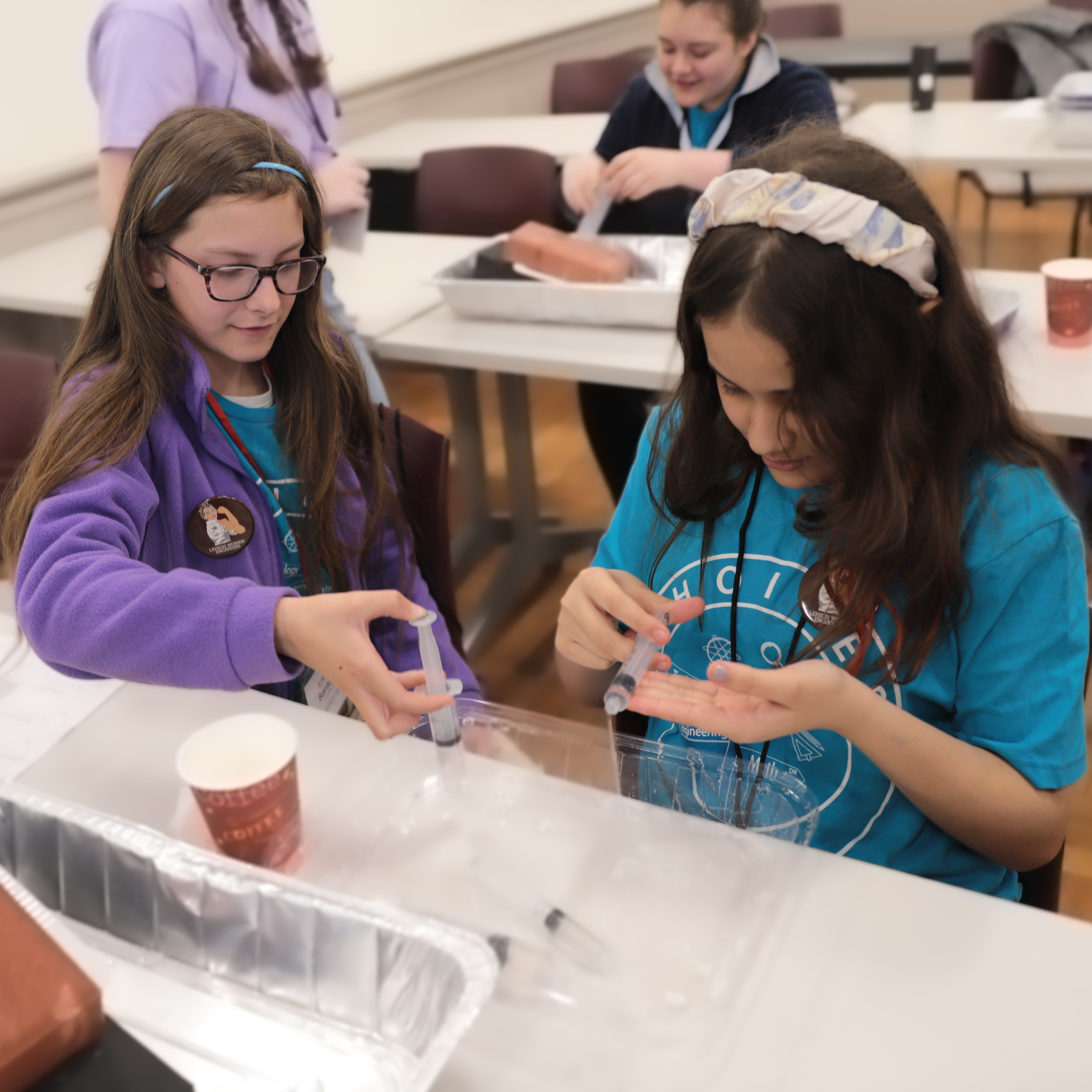 Two girls doing an experiment at Lehigh's CHOICES program 