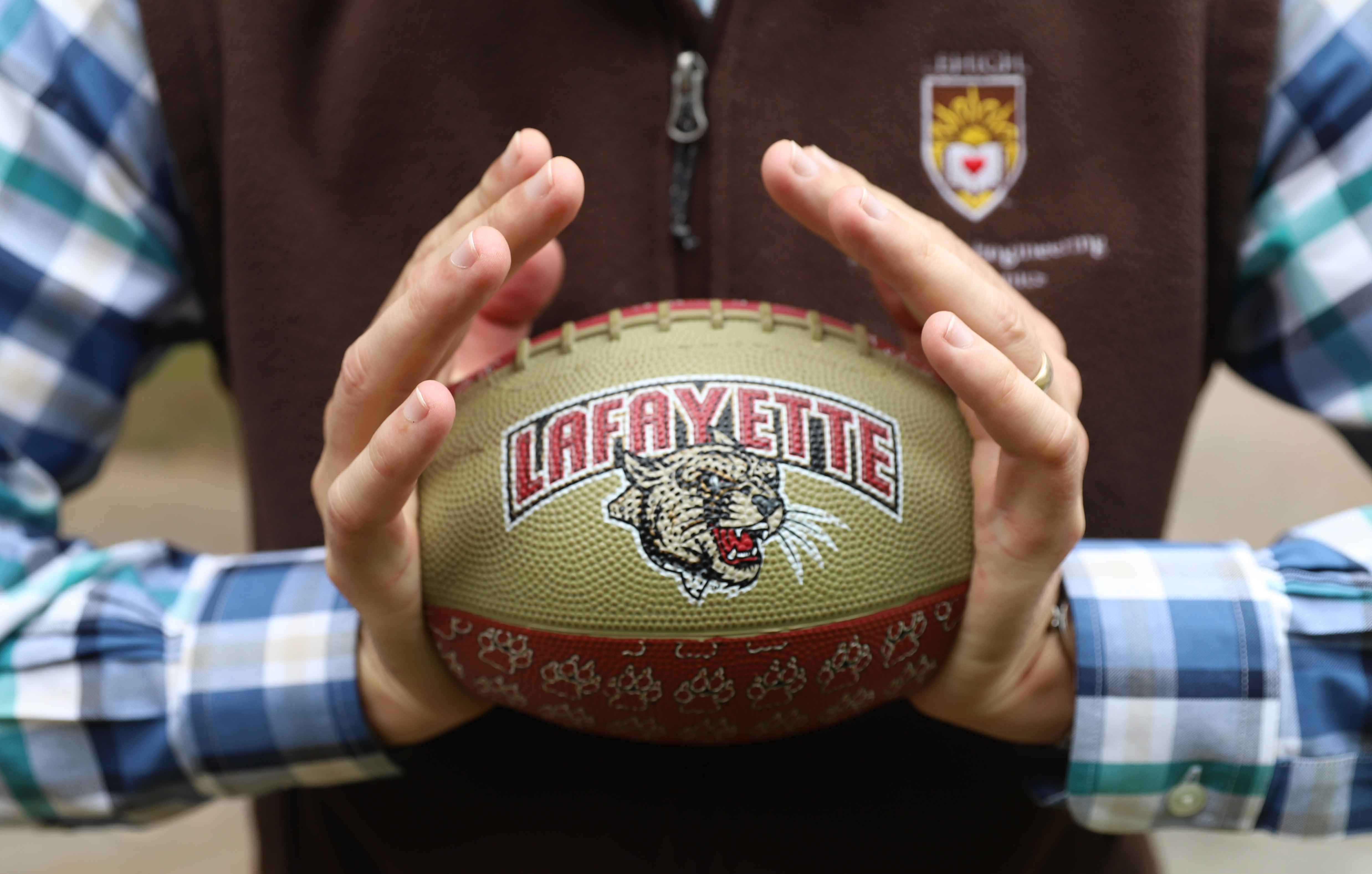 Professor Justin Jaworski crushing a Lafayette football