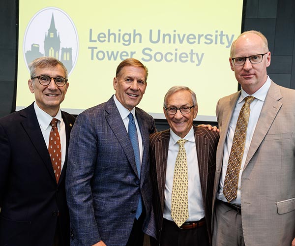 Joe Helble and Nathan Urban flank Kevin Clayton and Mike Caruso.