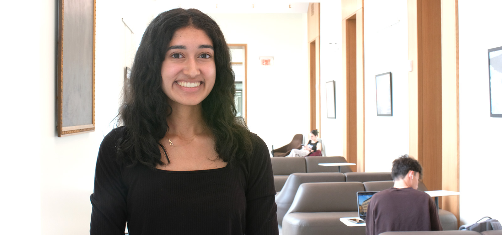 Anoushka Nambiar wears black inside the Clayton University Center