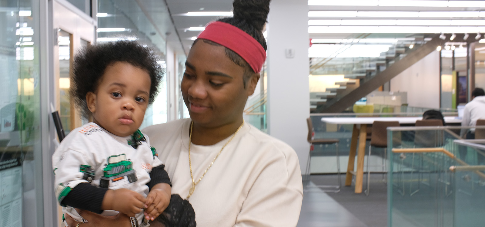 Janeya Allen looks down lovingly at her son.