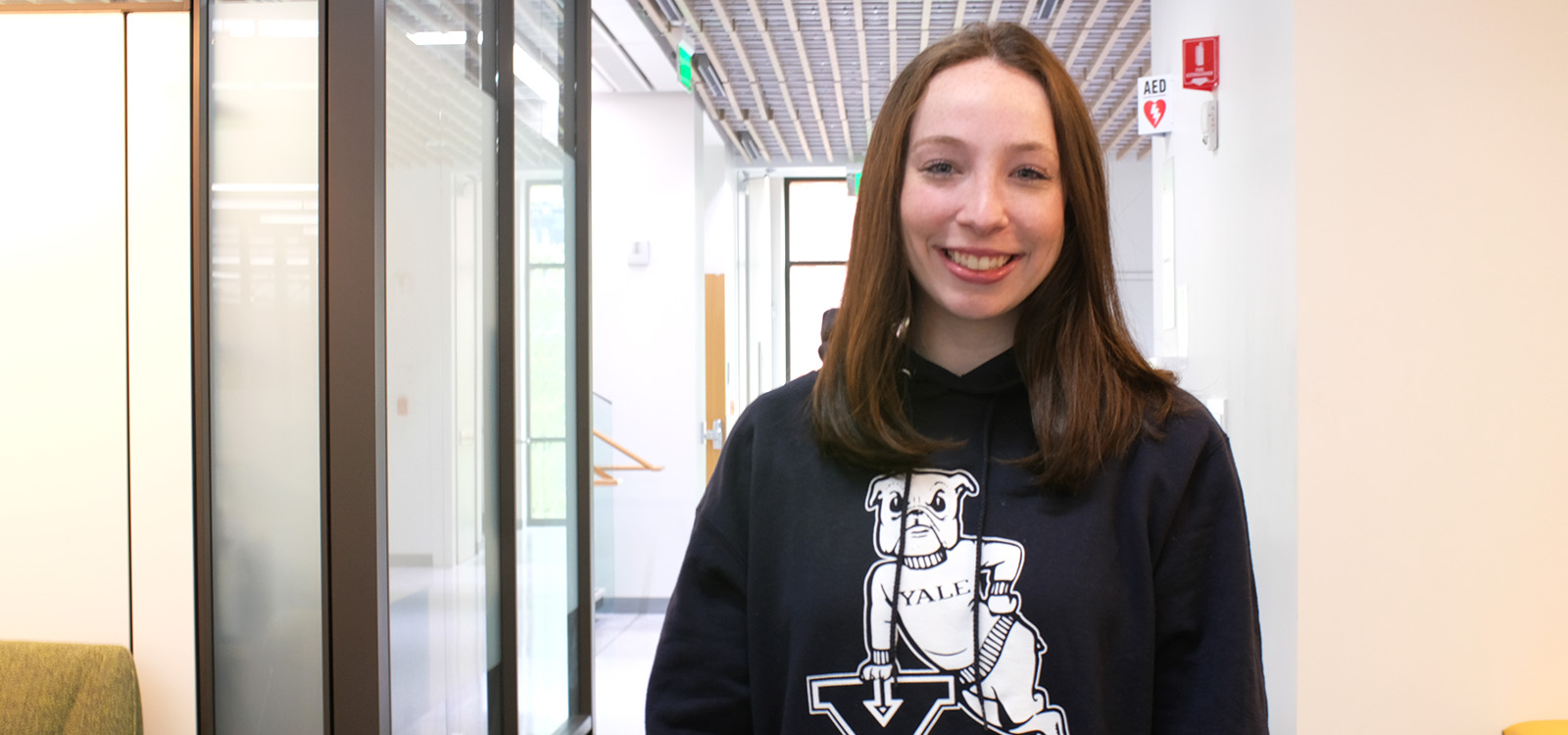 Jessica Berman wears a Yale hoodie inside the HST building