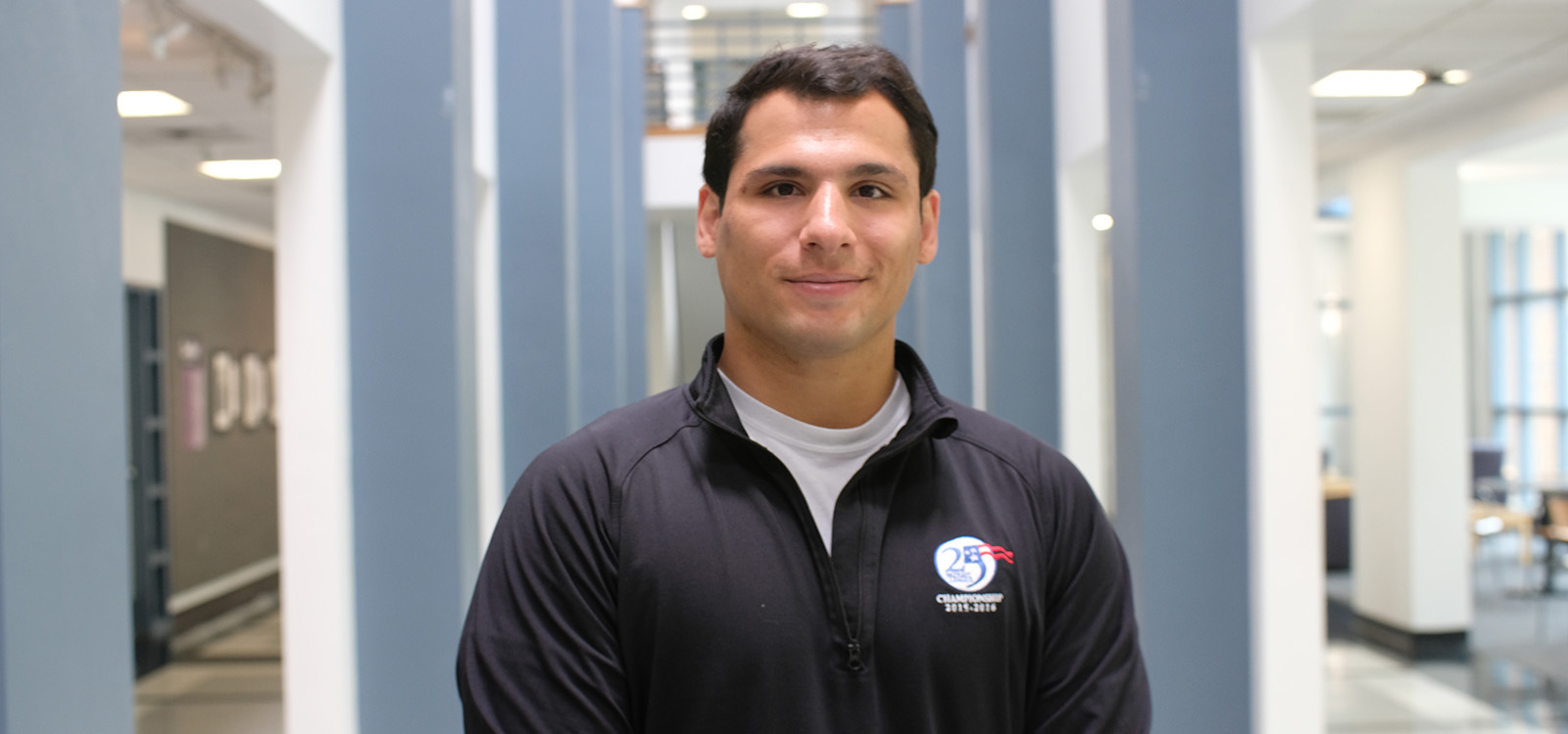 Nick Pecora wears his championship jacket inside Rauch