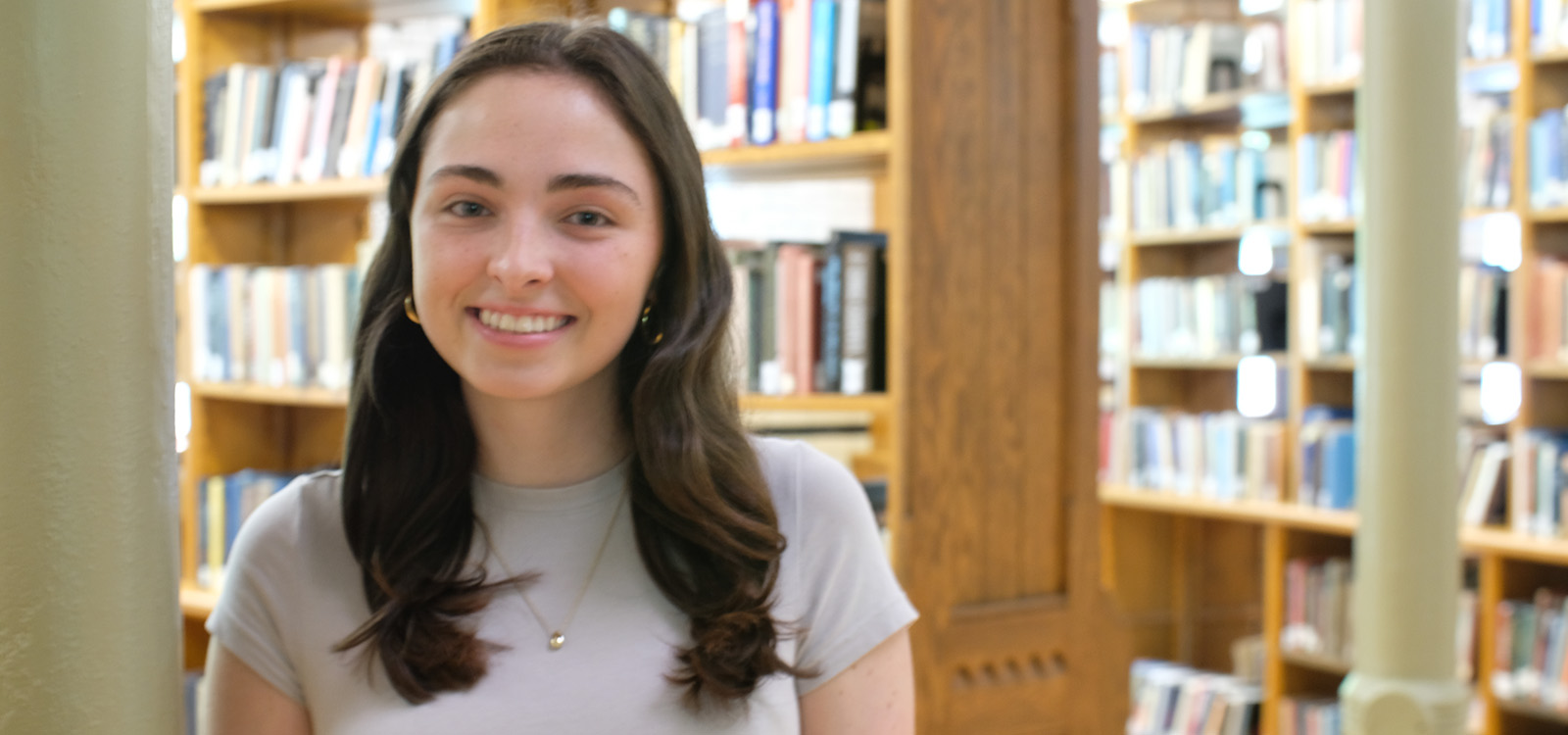 Sarah Kearns stands near the stacks in Linderman Library