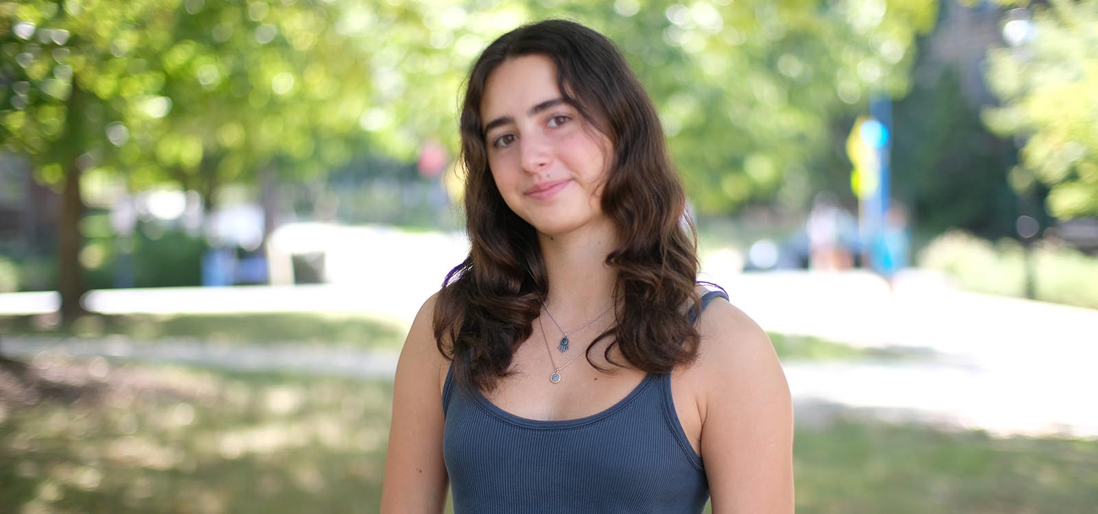 Hannah Null stands on campus near the library.