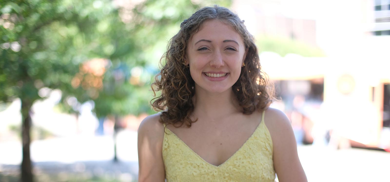 Samantha Sandhaus stands near the library.