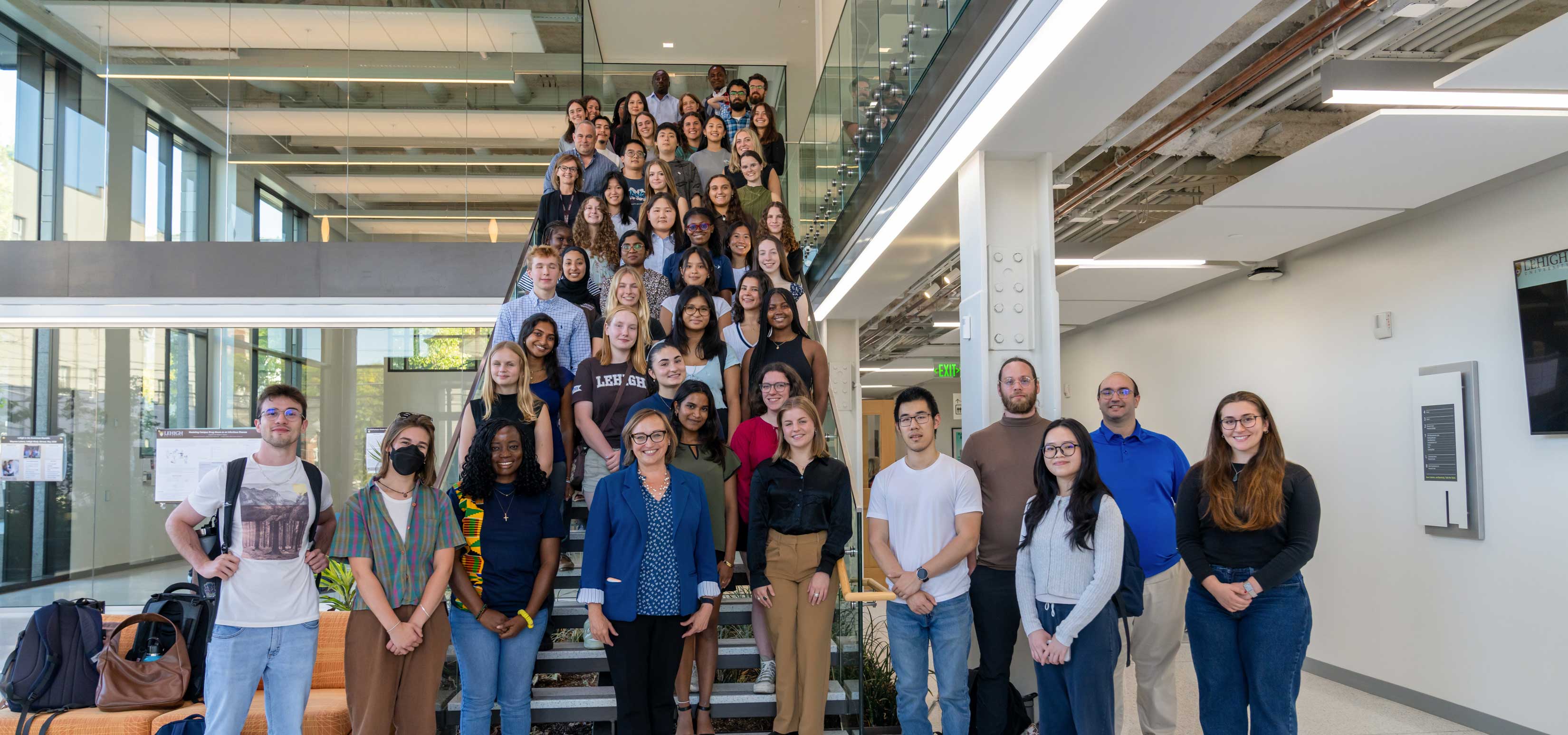 College of Health scholars gathered on a staircase. 