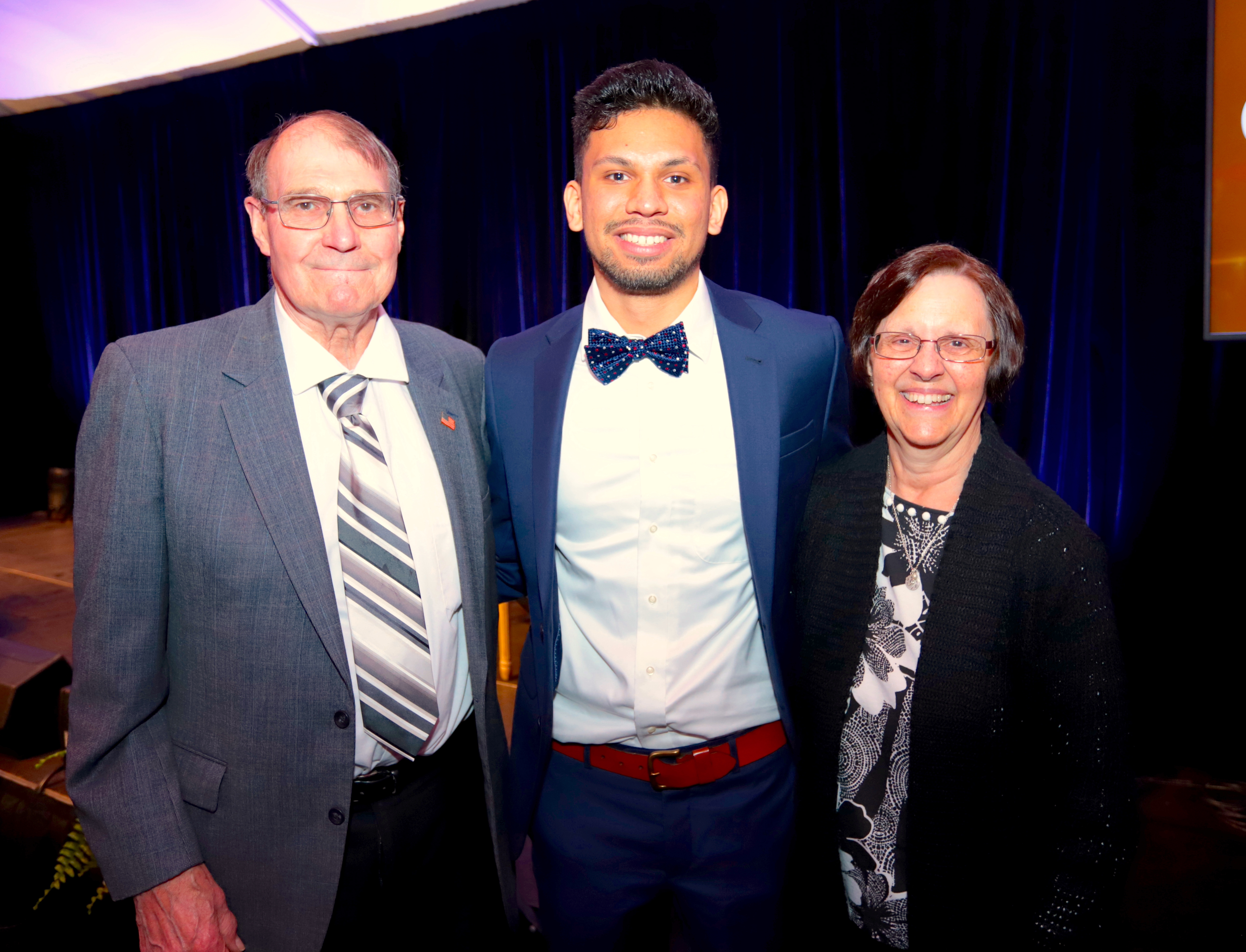 Sophomore Nicholas Barros ’24 posing with Clarence B. Campbell's son and his wife