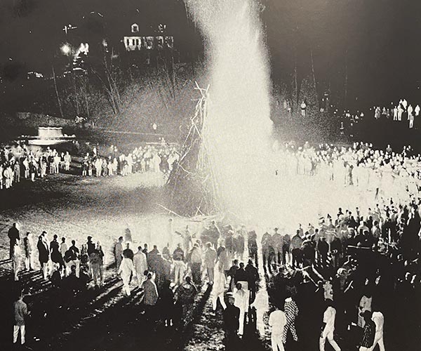 Students in the 1950s gather around the bonfire