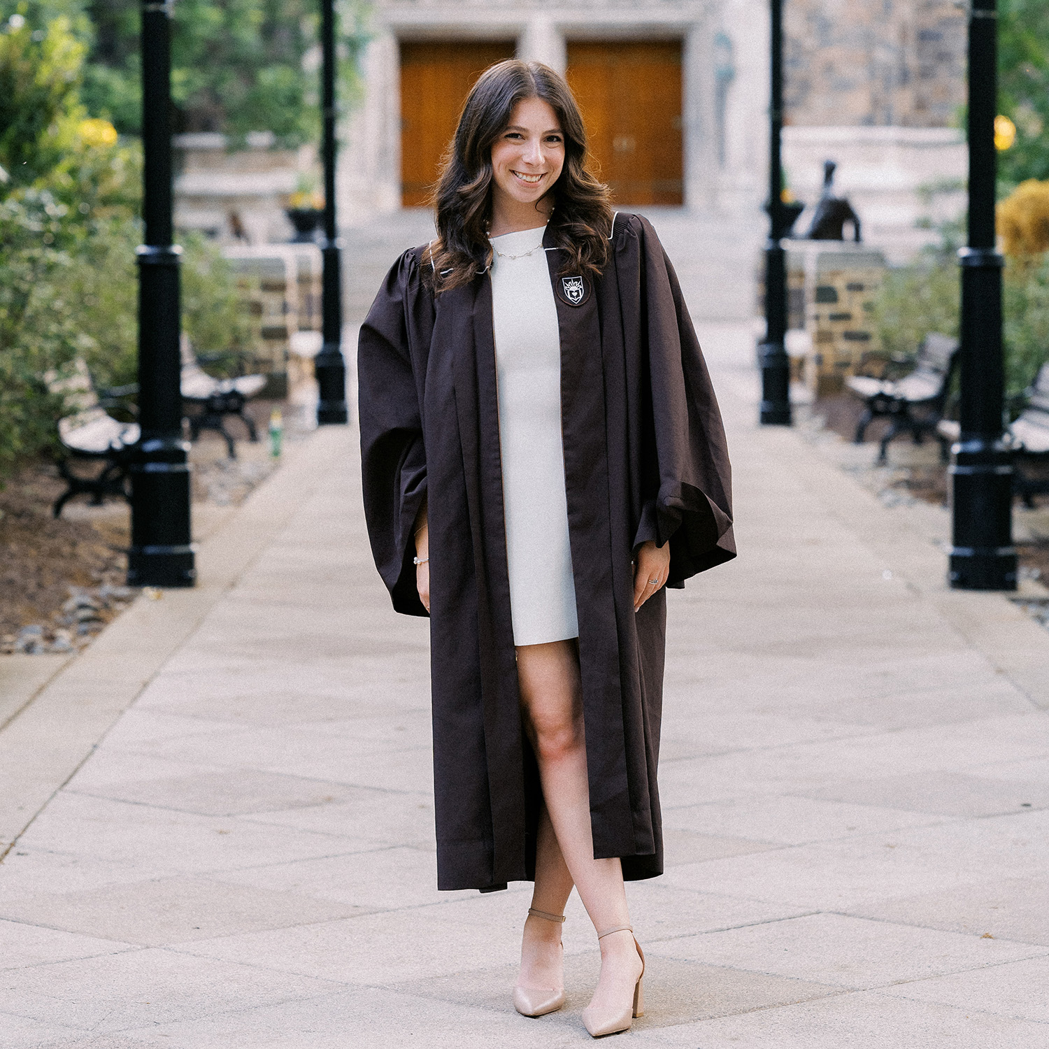 Aliya smiles in her Lehigh graduation gown.