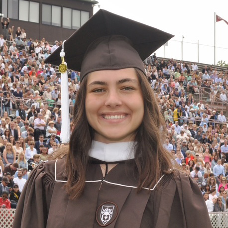 Angelique smiles in her Lehigh graduation cap and gown.