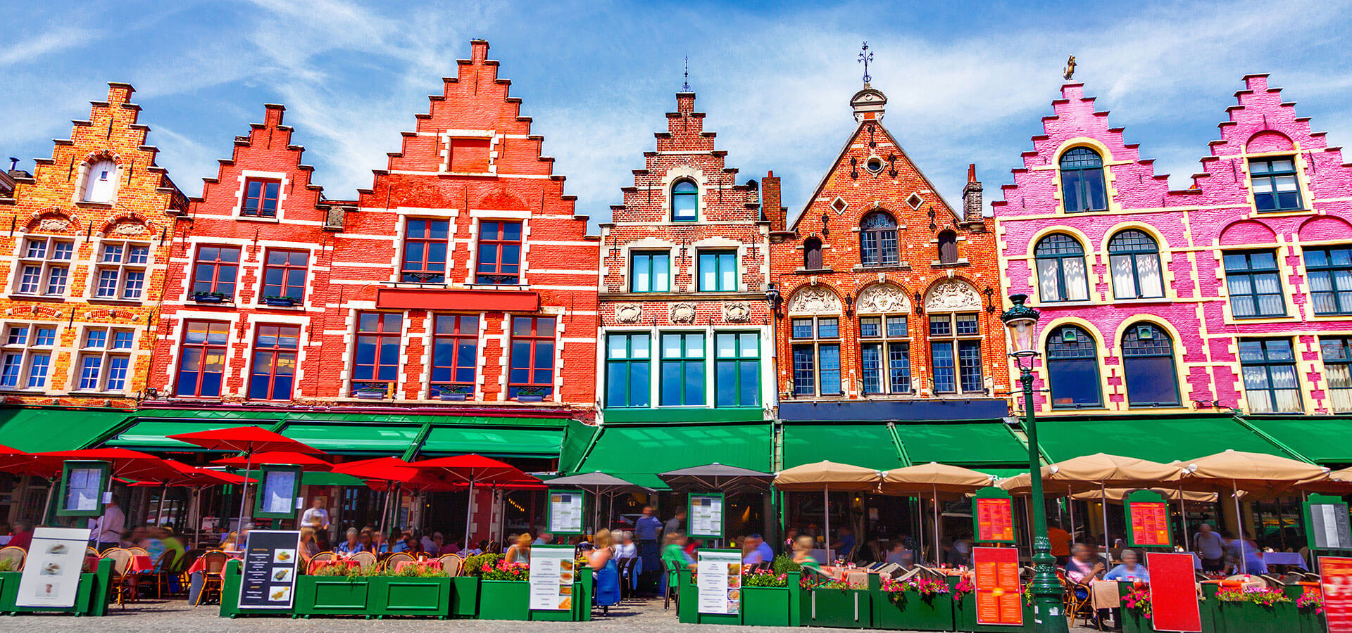 Brightly colored buildings with green awnings.