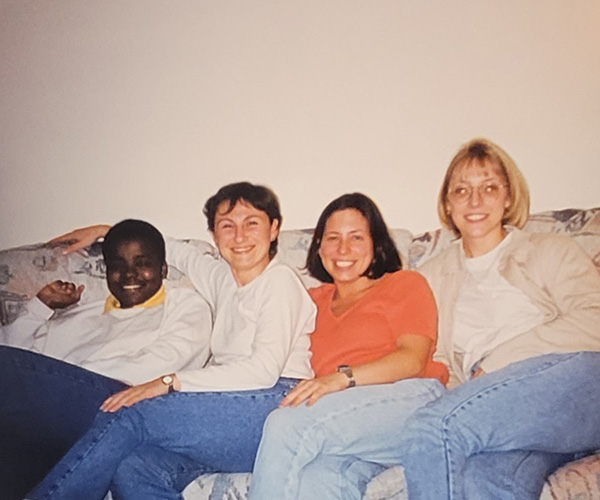 Christine Marty-Ochola sits on a couch with classmates from Lehigh