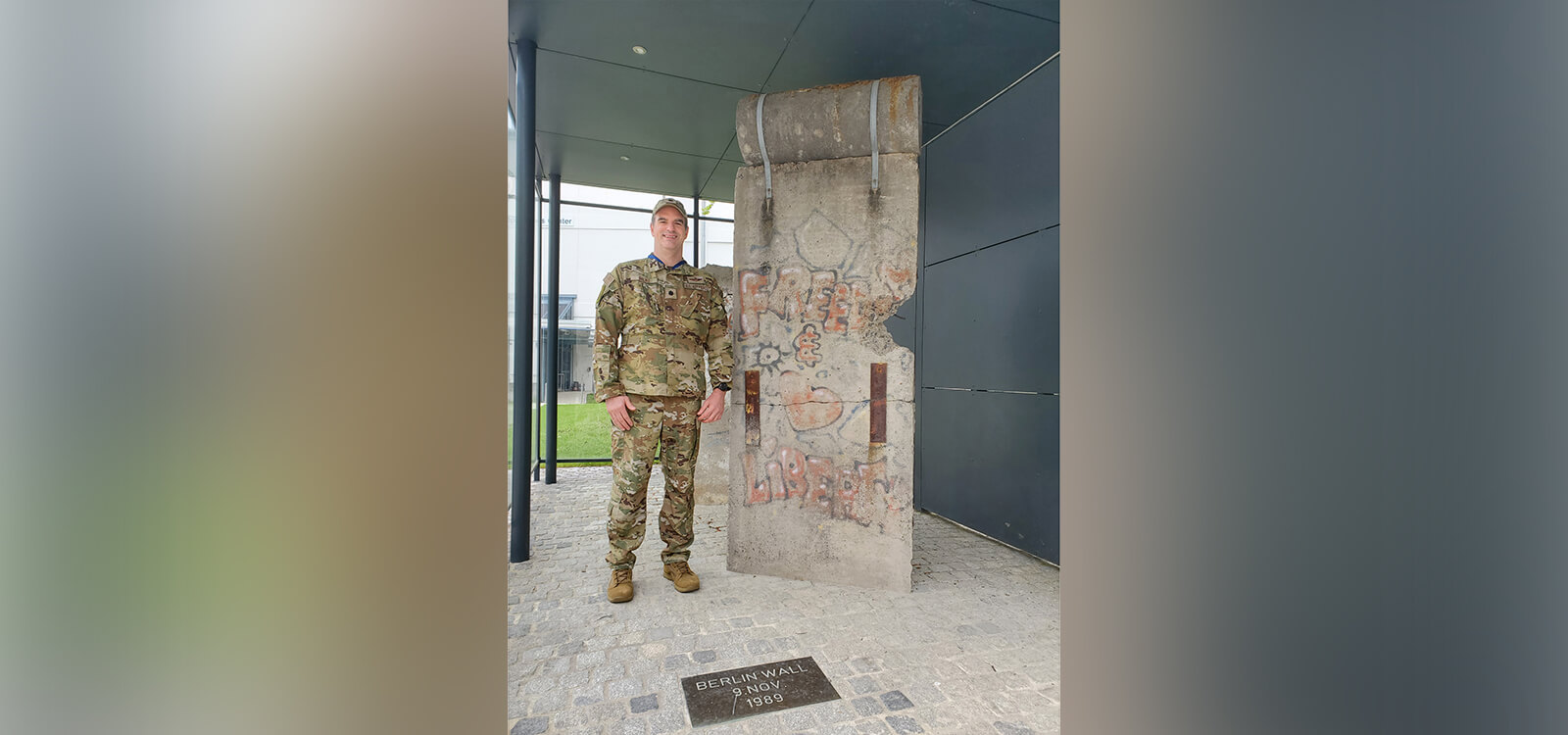 Lt. Col. Christopher Silko in fatigues at the Berlin Wall