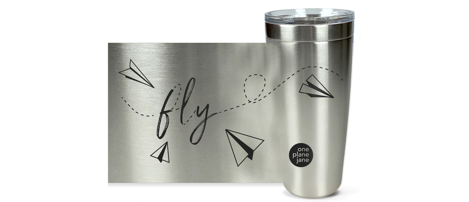 Silver travel cup decorated with illustrations of black paper airplanes and the word fly written in cursive.