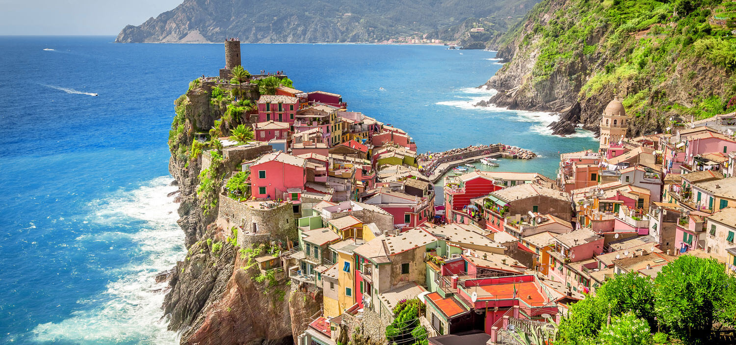 Colorful buildings along a coastal peninsula.