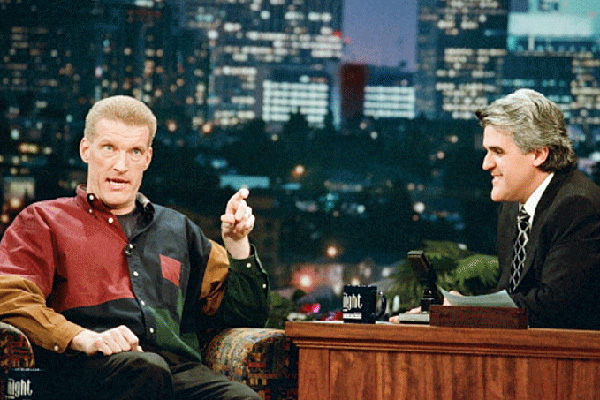 Don McMillan sits next to Jay Leno on the Tonight Show