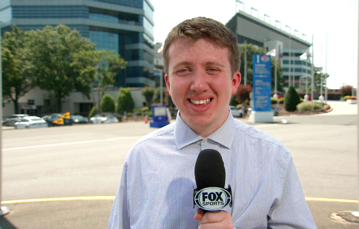 Eddie Fuhrer holding a microphone that says Fox News