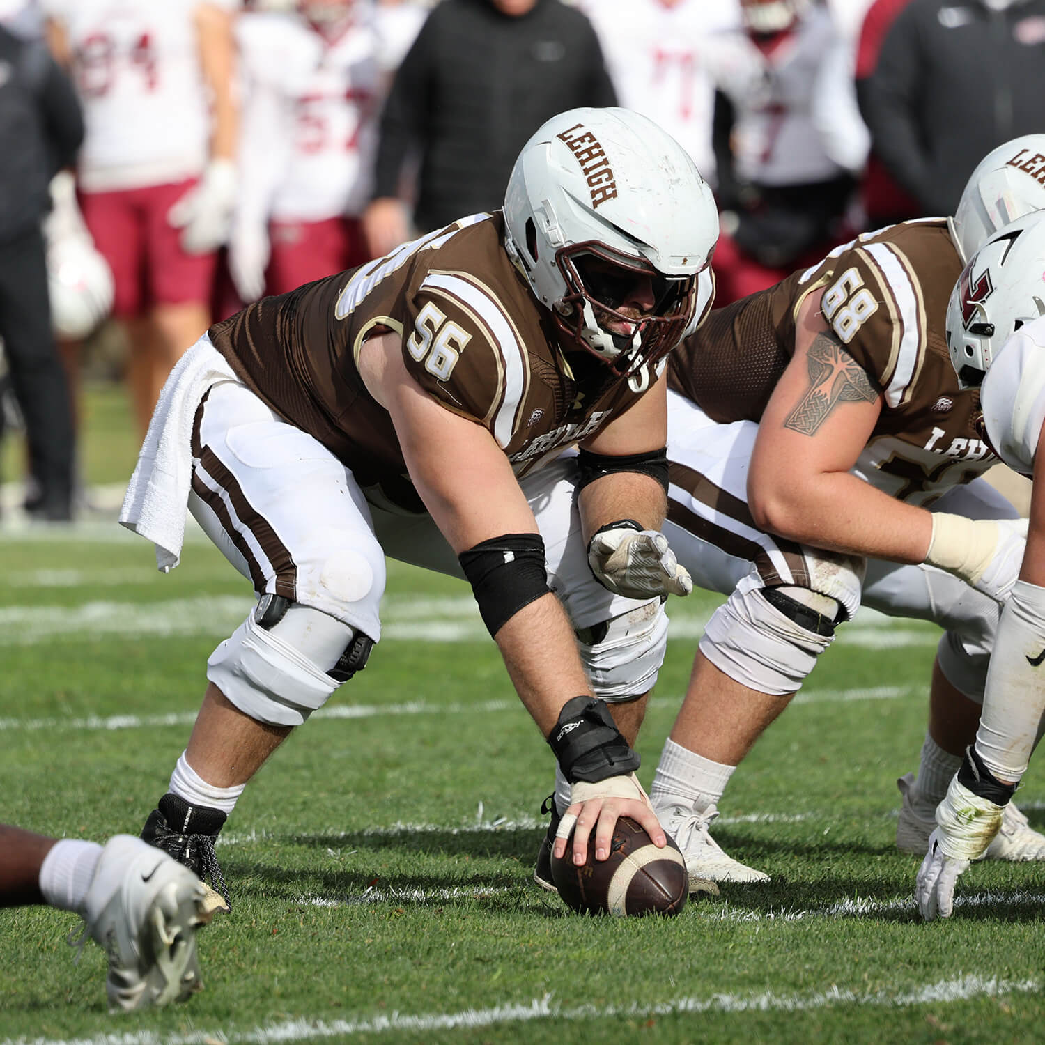 George Padezanin prepares to snap the ball during a football game