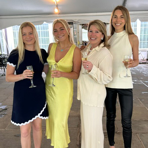 Four Hite women stand together with the girls around their mother