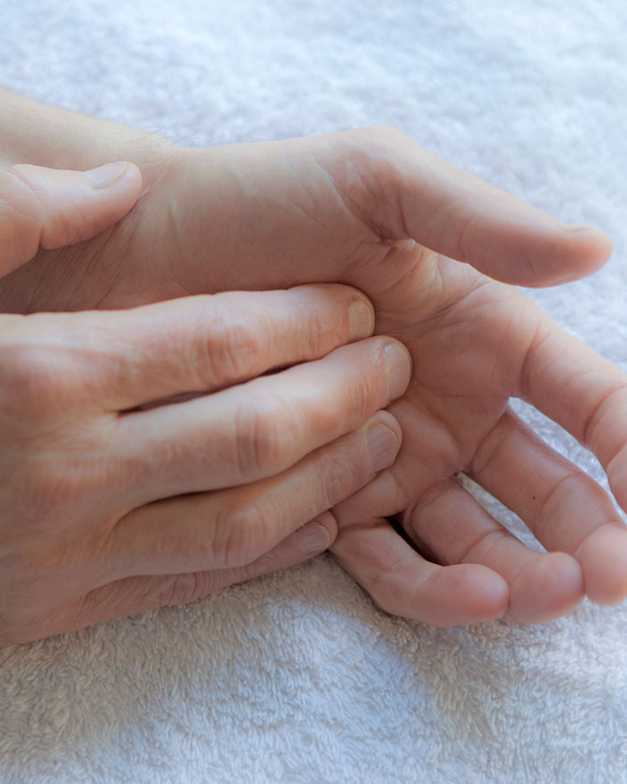 clean, soft hands resting on a towel