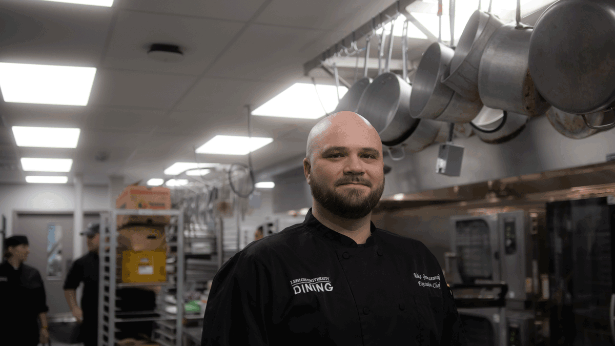 Chef Mike Gronczewski posing the kitchen on Lehigh University's campus