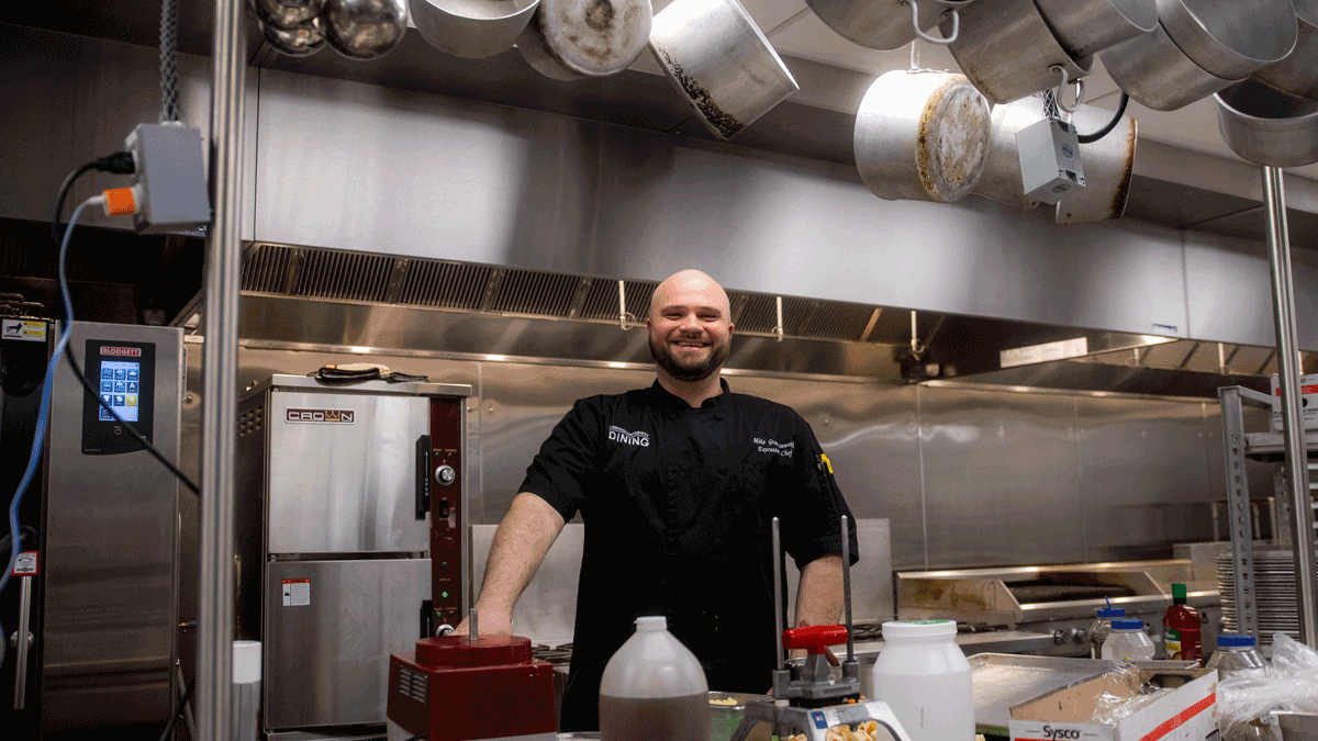 Chef Mike Gronczewski posing the kitchen on Lehigh University's campus