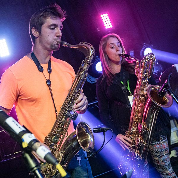 Mike and his spouse Vicky play their saxophones