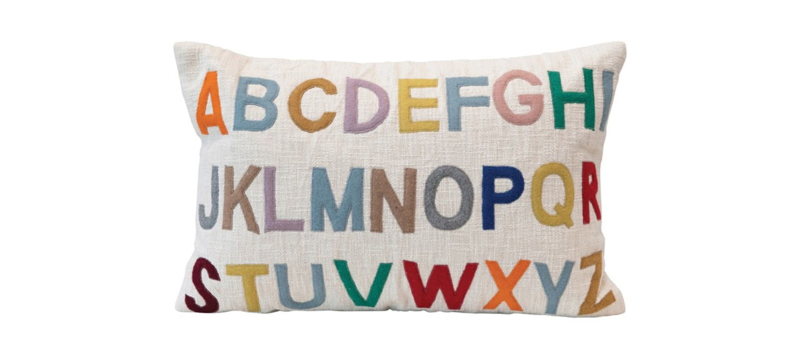 A beige pillow with each letter of the alphabet embroidered in a different color