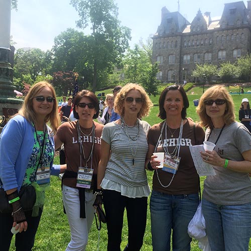 A group of Lehigh women stand together at Reunion in front of the UC