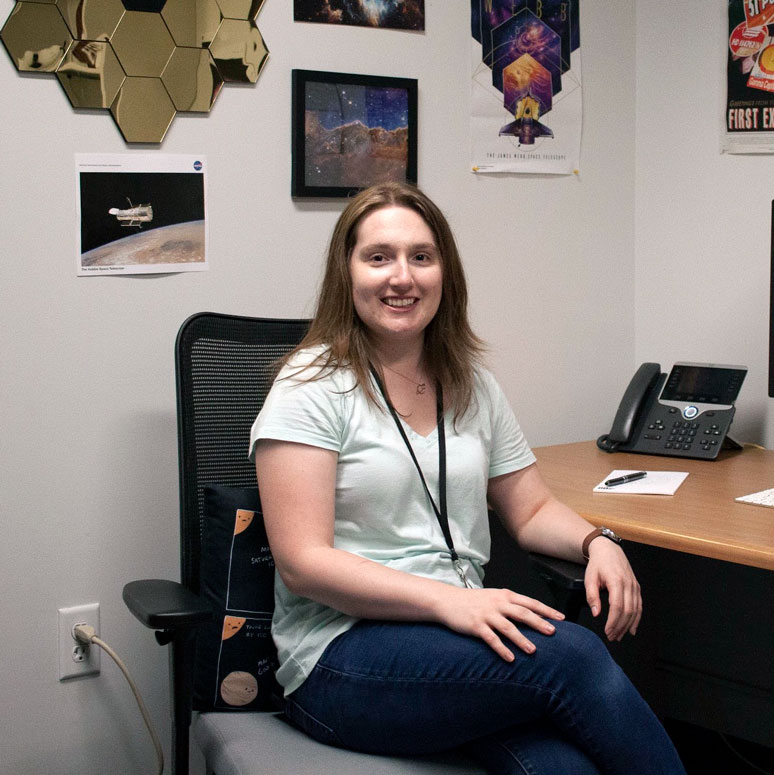 Lauren Miller sitting at her desk in her office