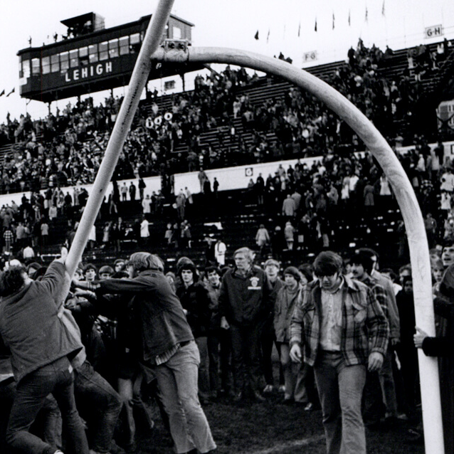 A group of Lehigh fans attempt to tear down the opposing team's goal post at a Le-Laf game.