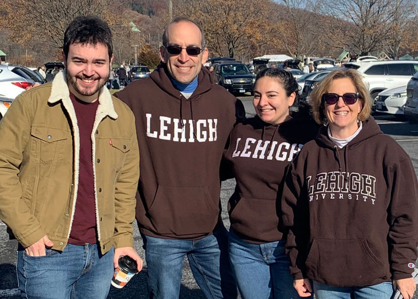 The Cohen family posing in their Lehigh gear and smiling