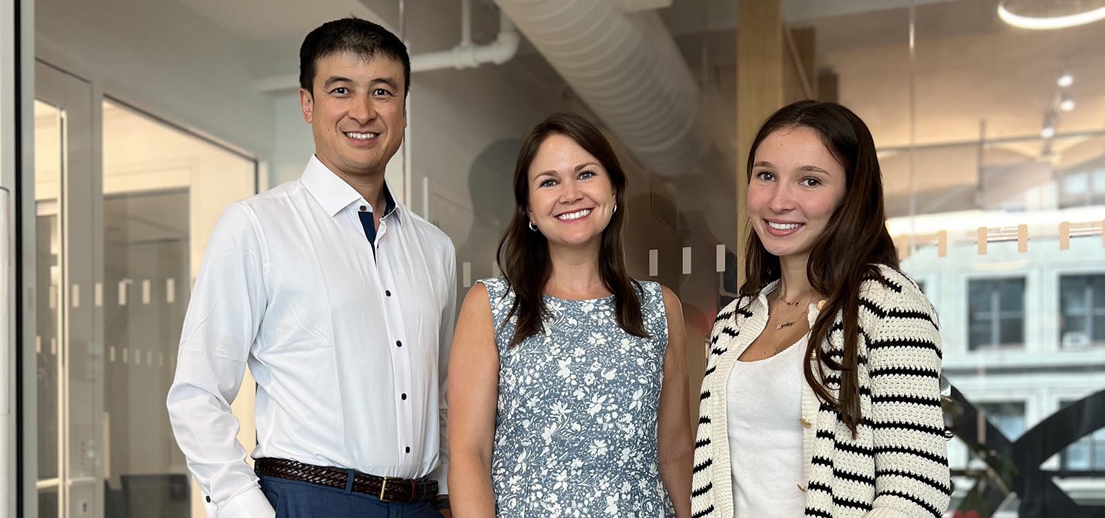 Student stands at the far right with two other Lehigh alumni