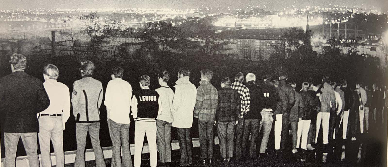 Men from 1970 McConn House stand on South Mountain and overlook the city