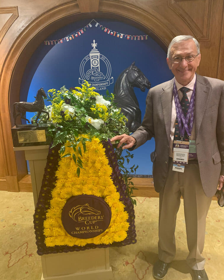 Mike Caruso standing next to the Breeder's Cup Championship