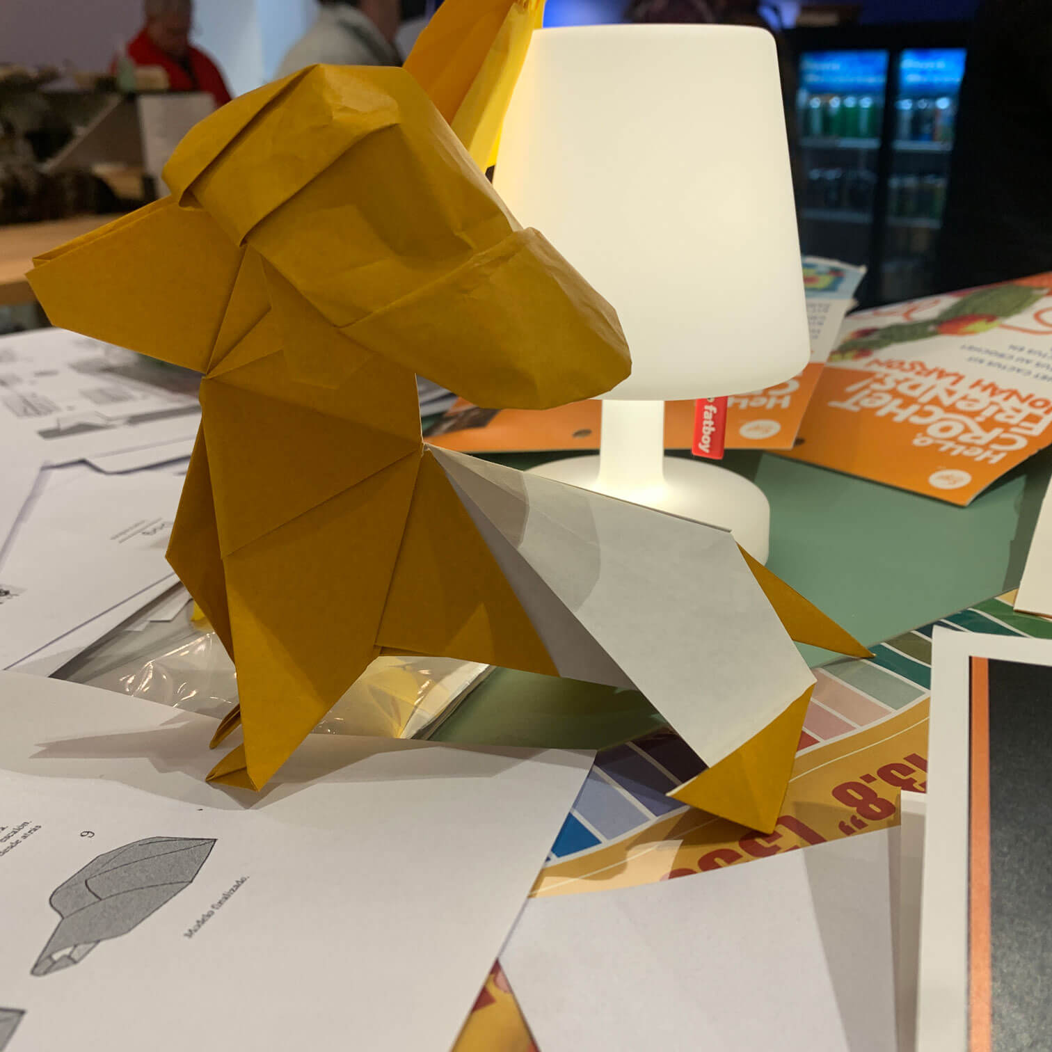 A tan origami dog made by Mo Chen