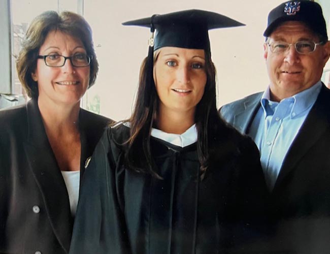 Pat and Don Stephenson stand on each side of their daughter at her Lehigh graduation