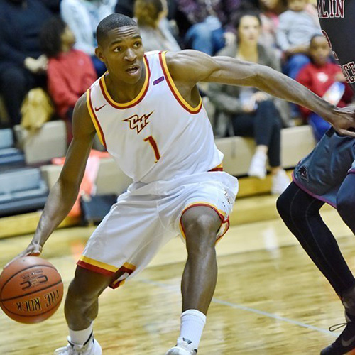 Noel Hightower dribbles during a game at Chestnut Hill College